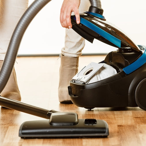 Miele vacuum cleaner assortment on display.